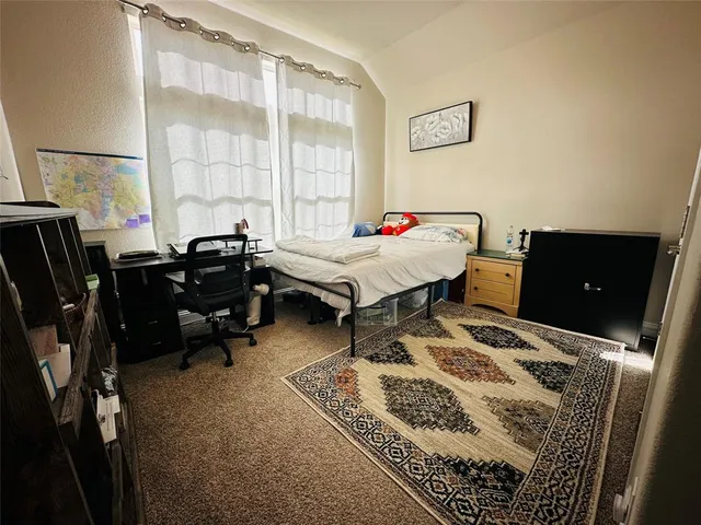 a workspace with furniture and a window