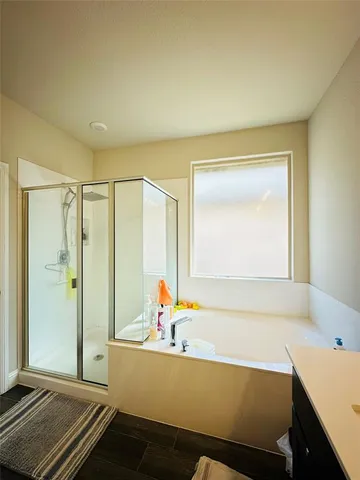 a living room with a bed and a window