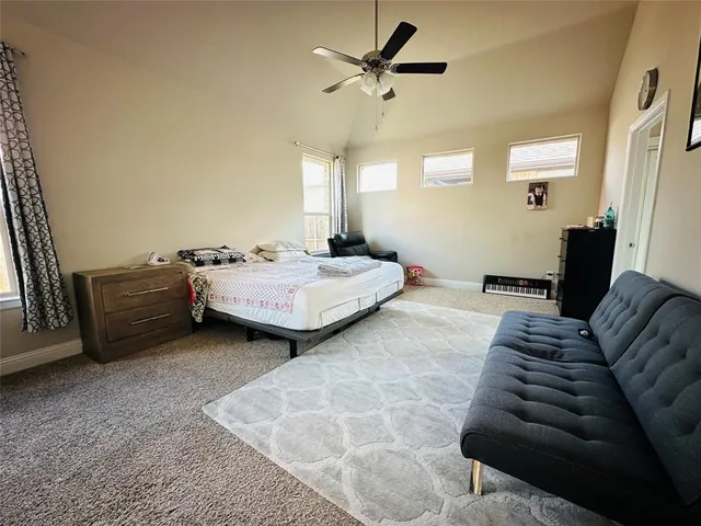 a bedroom with bed and window