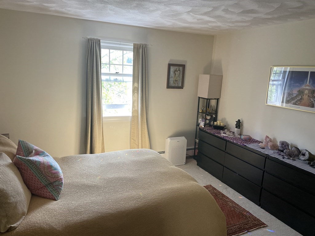 205 Great Road, Unit C8 Acton, MA 01720 - Photo 25 of 34 a bed room with a bed and a window
