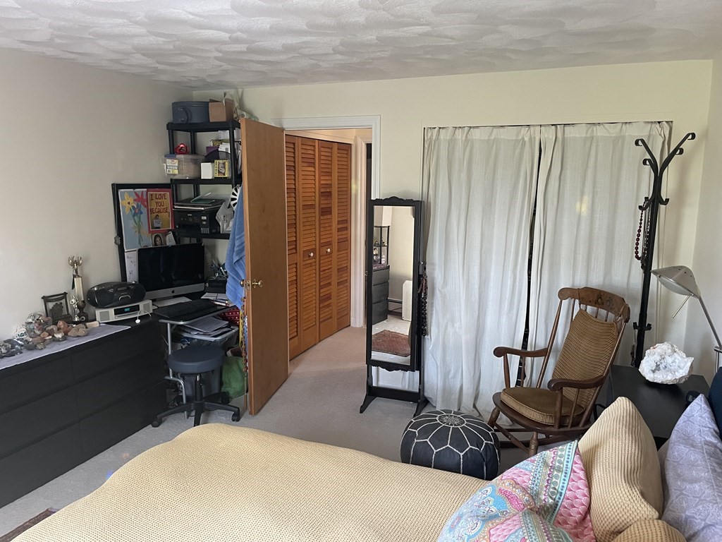 205 Great Road, Unit C8 Acton, MA 01720 - Photo 26 of 34 a work room with furniture a rug and gym equipment
