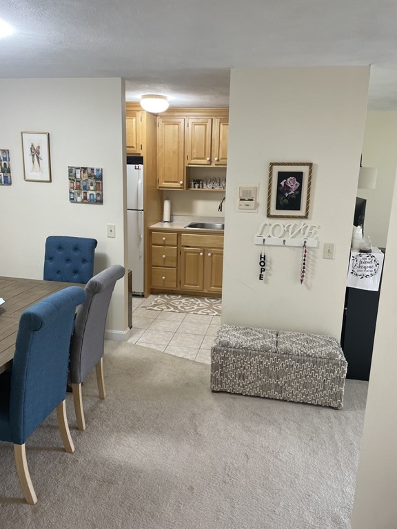 205 Great Road, Unit C8 Acton, MA 01720 - Photo 27 of 34 a living room with furniture and a wooden floor