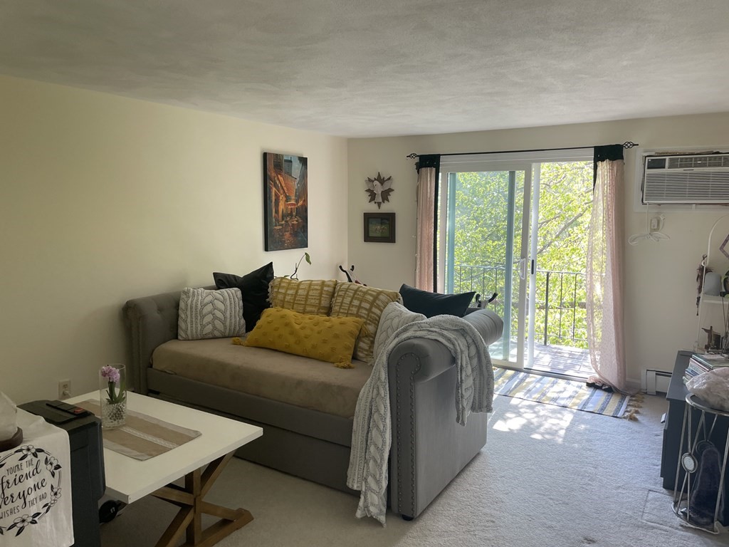 205 Great Road, Unit C8 Acton, MA 01720 - Photo 30 of 34 a living room with furniture and a window
