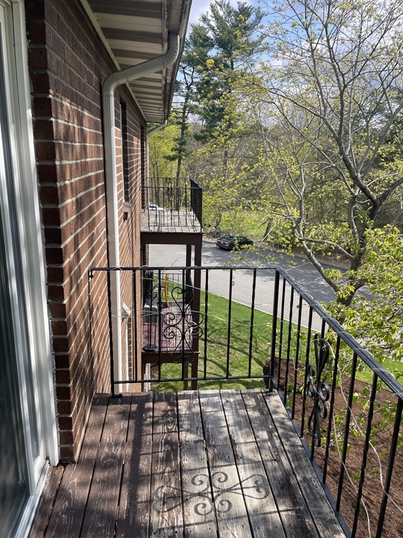 205 Great Road, Unit C8 Acton, MA 01720 - Photo 31 of 34 a view of a pathway with a balcony