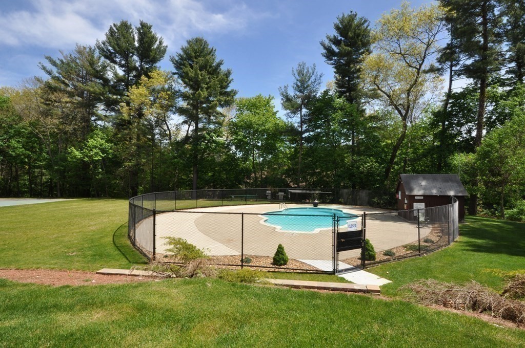 205 Great Road, Unit C8 Acton, MA 01720 - Photo 4 of 34 a view of a backyard with swimming pool