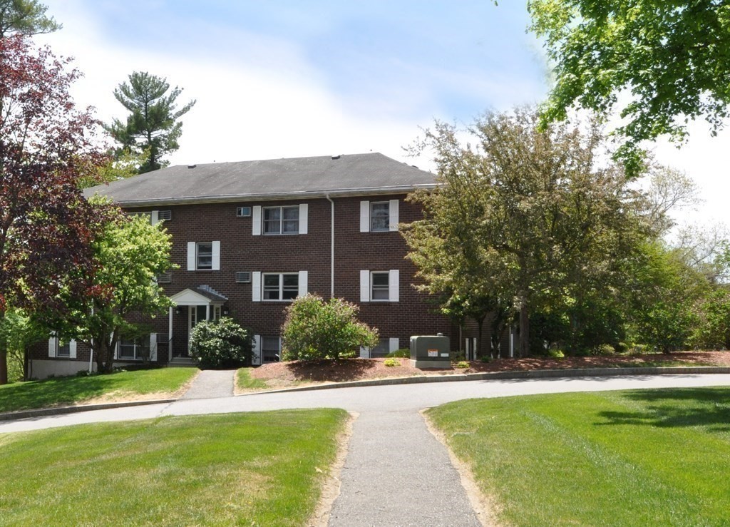205 Great Road, Unit C8 Acton, MA 01720 - Photo 5 of 34 a view of a house with swimming pool and a chairs in a patio