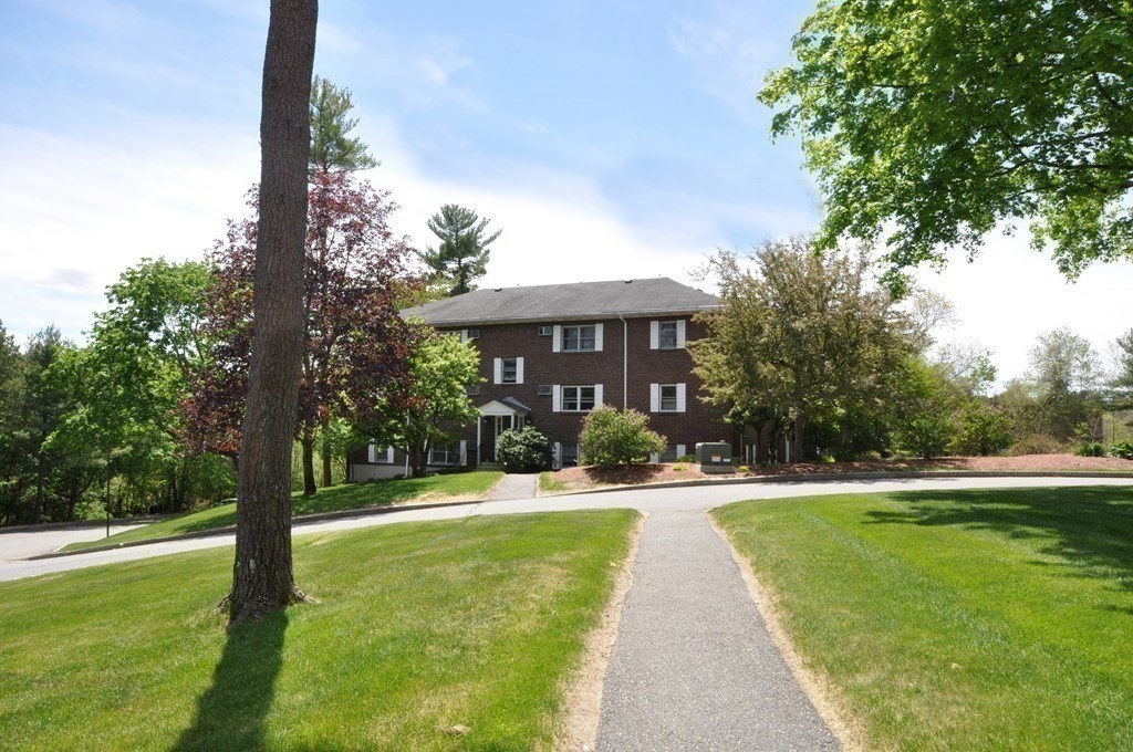 205 Great Road, Unit C8 Acton, MA 01720 - Photo 7 of 34 a view of a house with swimming pool and a yard