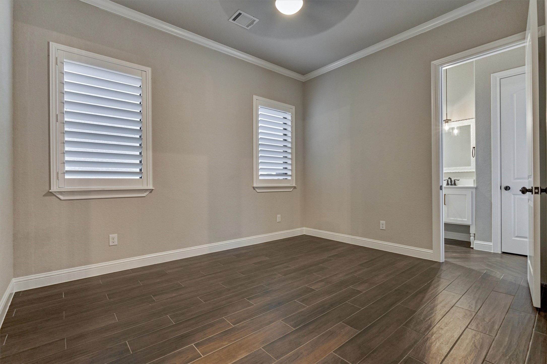 11618 Renaissance Drive Montgomery, TX 77356 - Photo 28 of 49 A third guest bedroom on the first floor features its own en-suite bath (also serving as the pool bath) and a spacious walk-in closet.