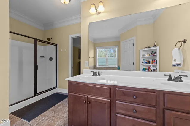 a bathroom with a tub sink and mirror