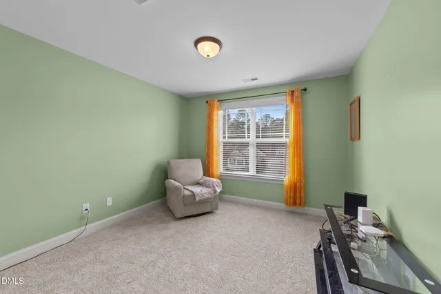 a bedroom with bed and a window