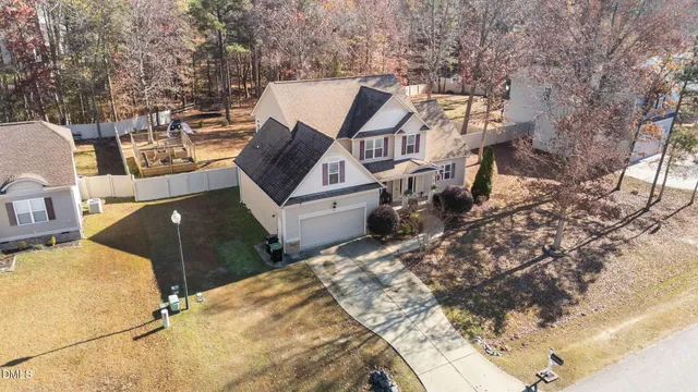 a view of a house with wooden fence