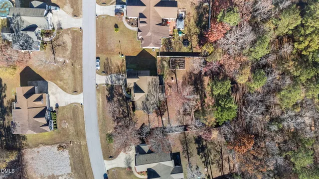an aerial view of multiple house with yard