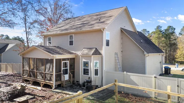 a view of a backyard with chairs