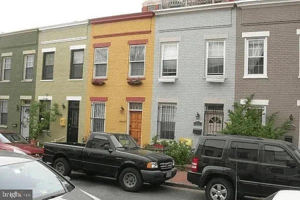 a view of a car parked in front of a building