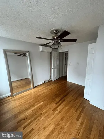 a view of empty room and wooden floor