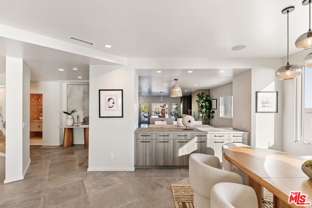 31558 Victoria Point Road Malibu, CA 90265 - Photo 18 of 55 a large living room with stainless steel appliances kitchen island granite countertop furniture and a kitchen view