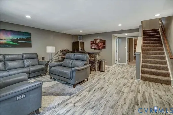 a dining room with furniture and wooden floor