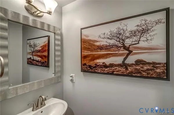 a kitchen with granite countertop kitchen island stainless steel appliances a refrigerator and a sink