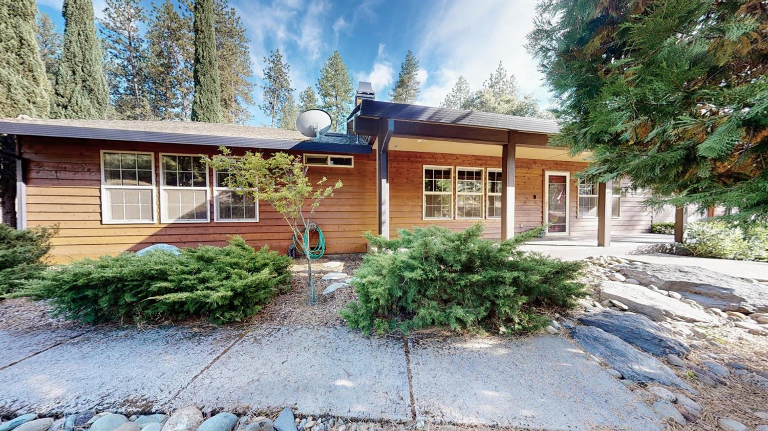 2660 Brown Bear Trail Cool, CA 95614 - Photo 1 of 1 a front view of a house with garden
