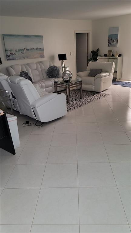 6574 Burning Wood Drive, Unit 101 Boca Raton, FL 33433 - Photo 21 of 25 a living room with furniture