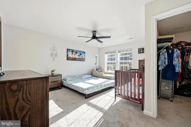 a bedroom with furniture and a window
