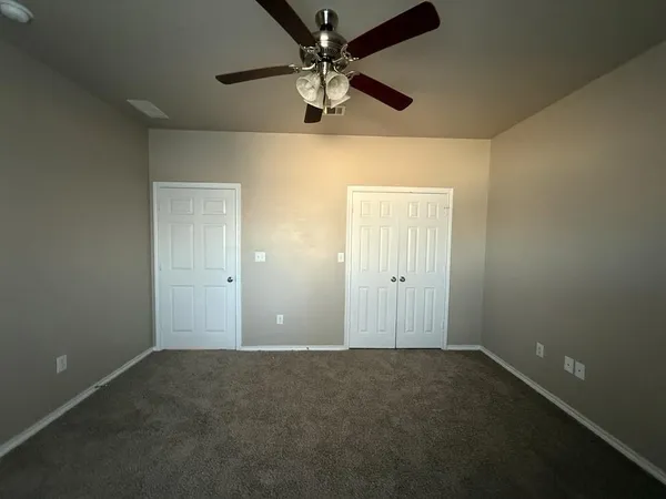 a view of a livingroom with a ceiling fan