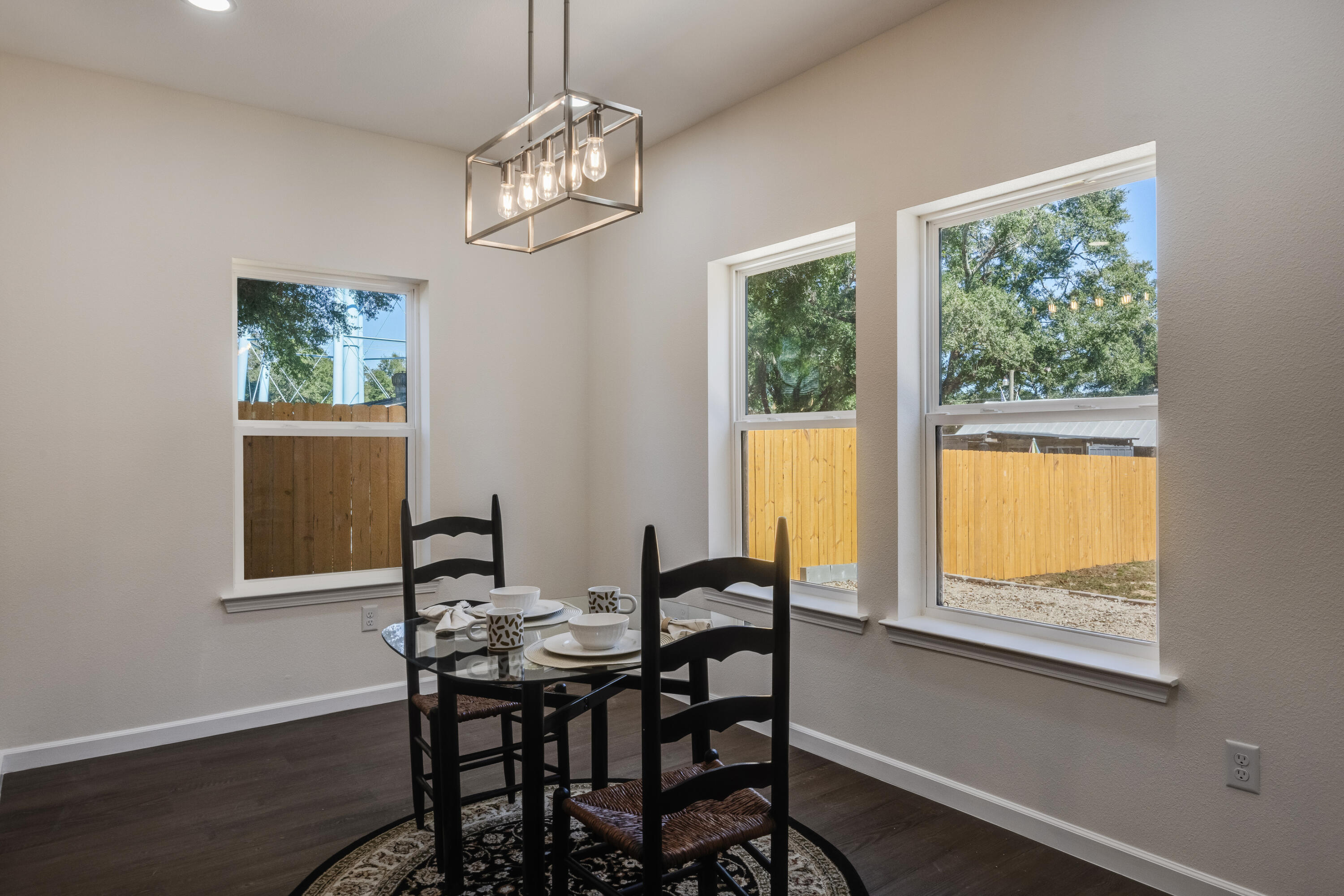 751 Amos Street, Unit A AND B Crestview, FL 32539 - Photo 12 of 47 a view of a dining room with furniture a chandelier and wooden floor