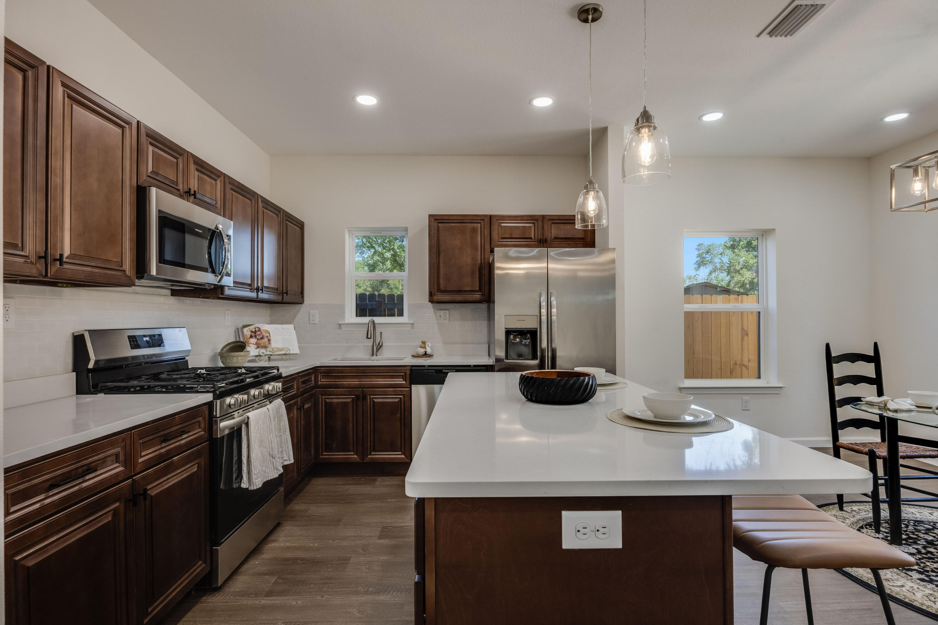 751 Amos Street, Unit A AND B Crestview, FL 32539 - Photo 16 of 47 a kitchen with kitchen island granite countertop a sink counter top space stainless steel appliances and cabinets