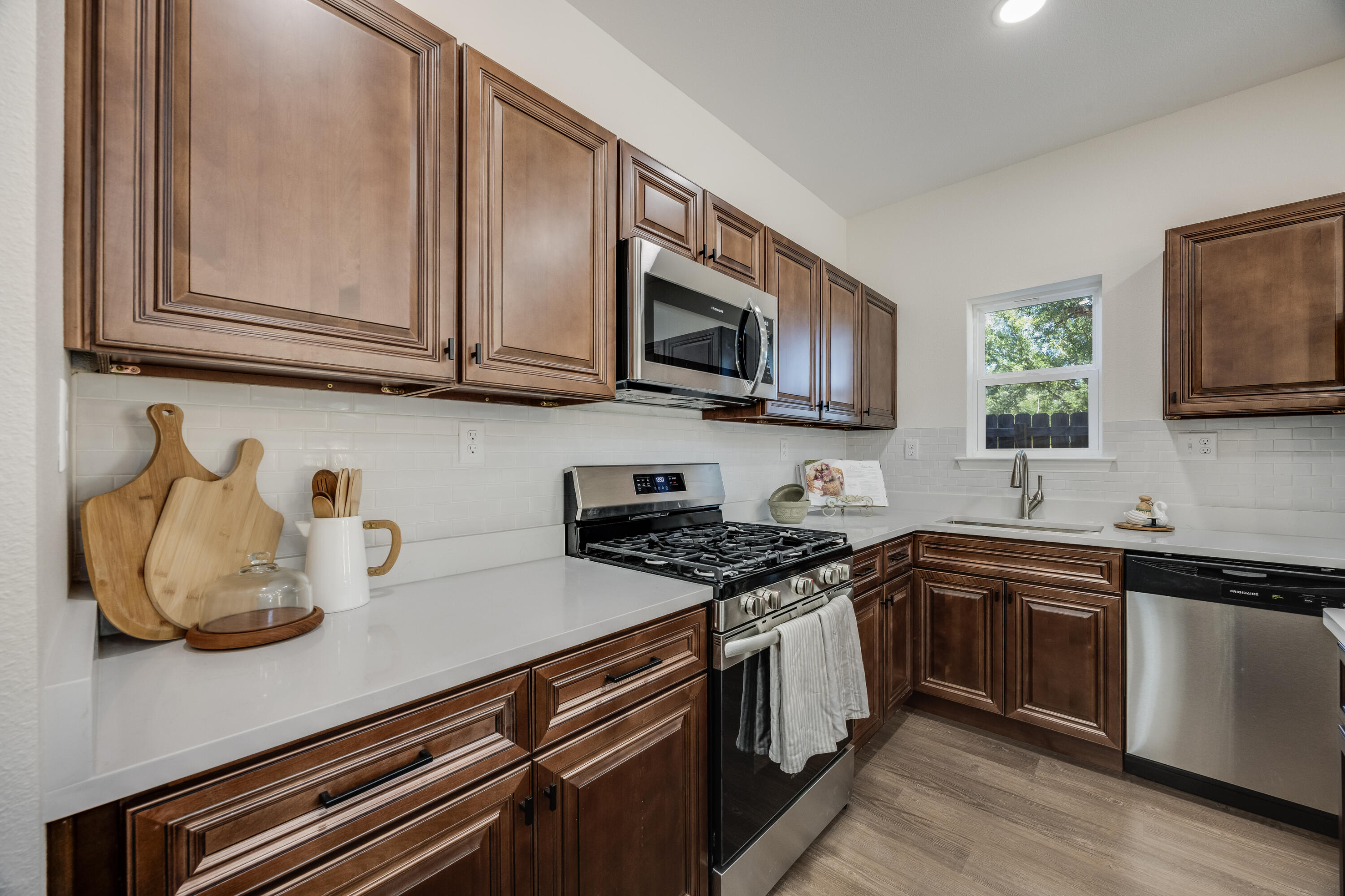 751 Amos Street, Unit A AND B Crestview, FL 32539 - Photo 18 of 47 a kitchen with stainless steel appliances granite countertop a sink stove and microwave