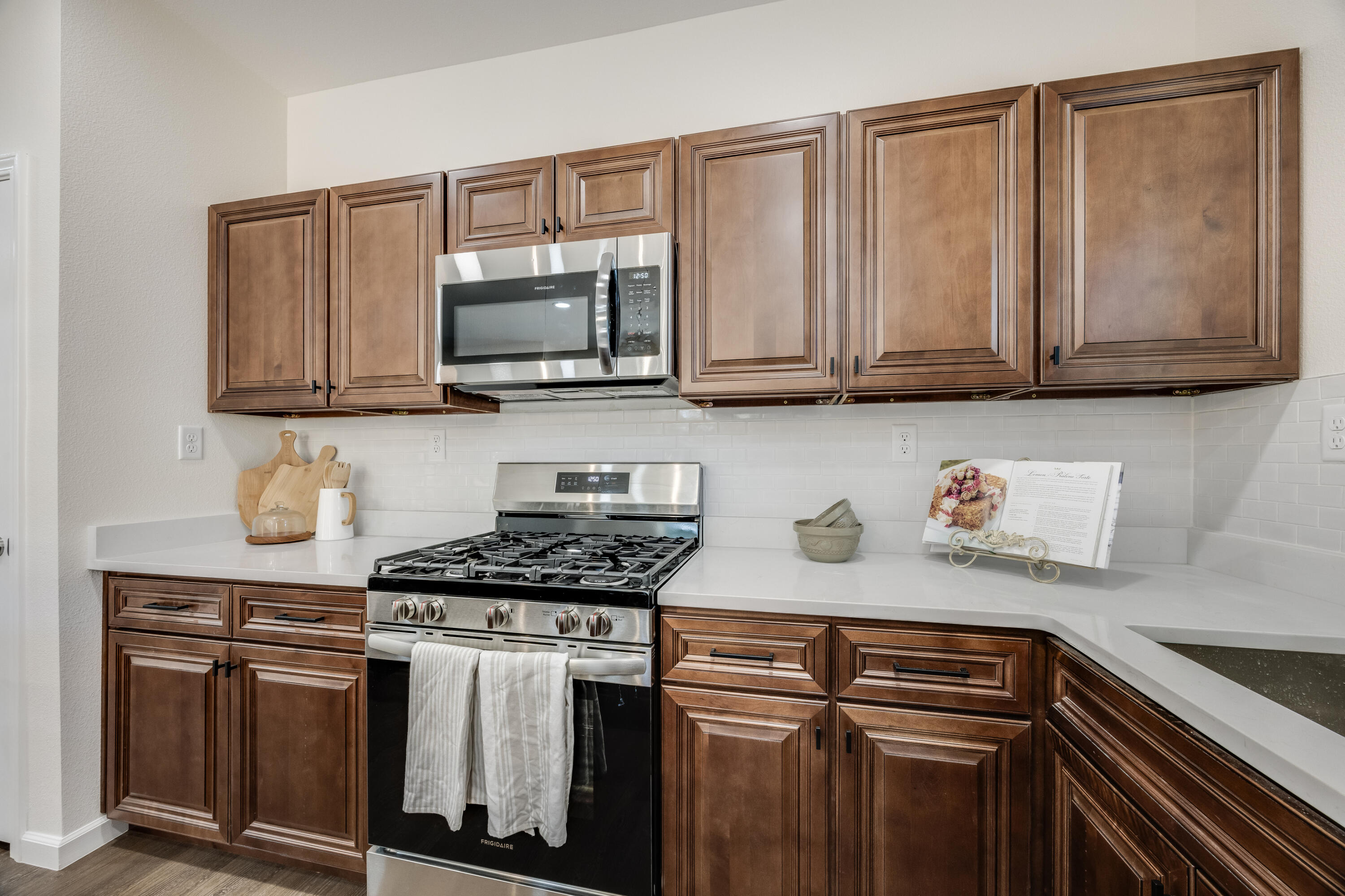 751 Amos Street, Unit A AND B Crestview, FL 32539 - Photo 19 of 47 a kitchen with stainless steel appliances granite countertop a stove a sink and a microwave