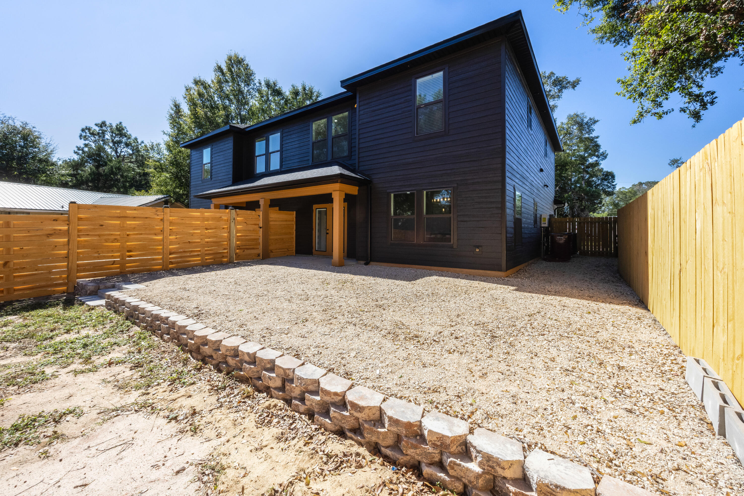 751 Amos Street, Unit A AND B Crestview, FL 32539 - Photo 21 of 47 a front view of a house with a yard