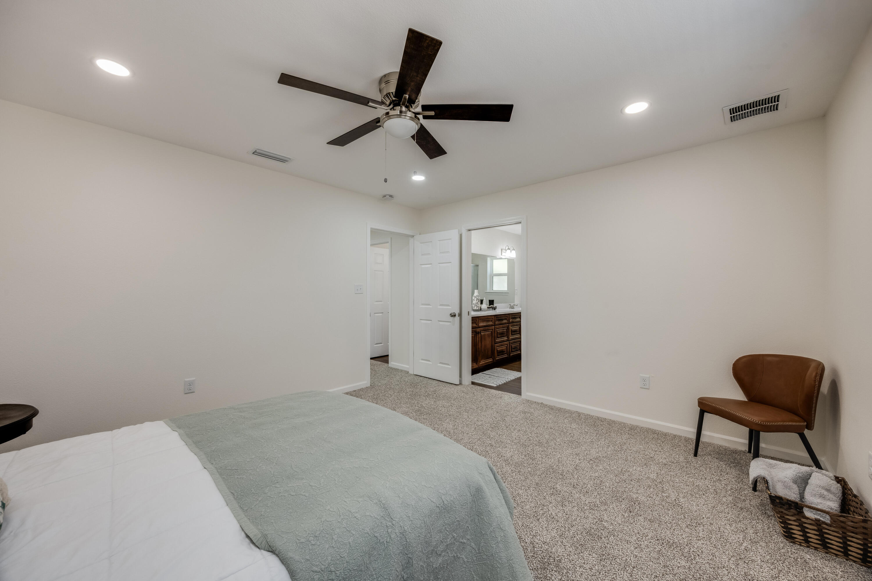 751 Amos Street, Unit A AND B Crestview, FL 32539 - Photo 28 of 47 a bedroom with a bed and a chair