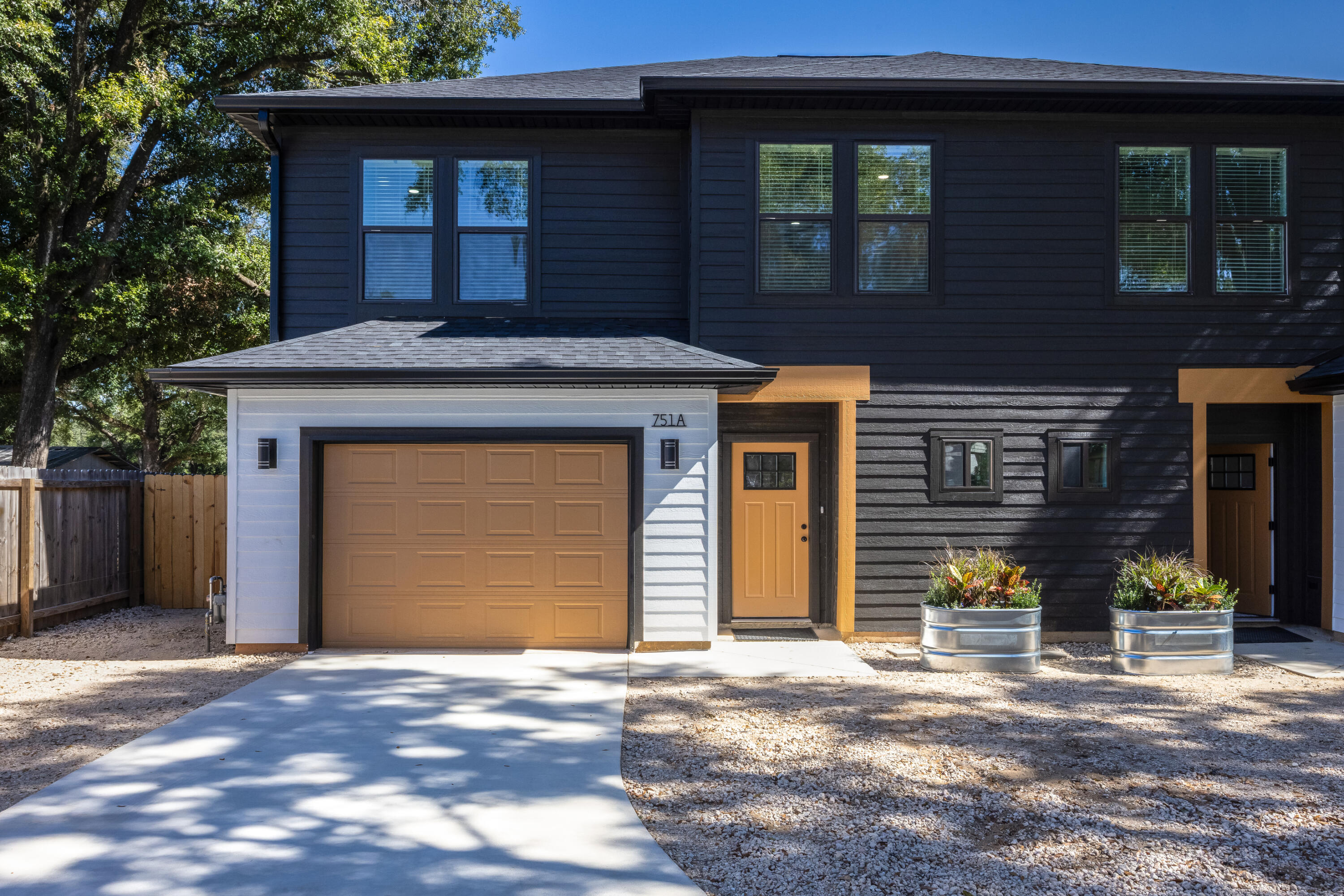 751 Amos Street, Unit A AND B Crestview, FL 32539 - Photo 46 of 47 a front view of a house with a yard and garage