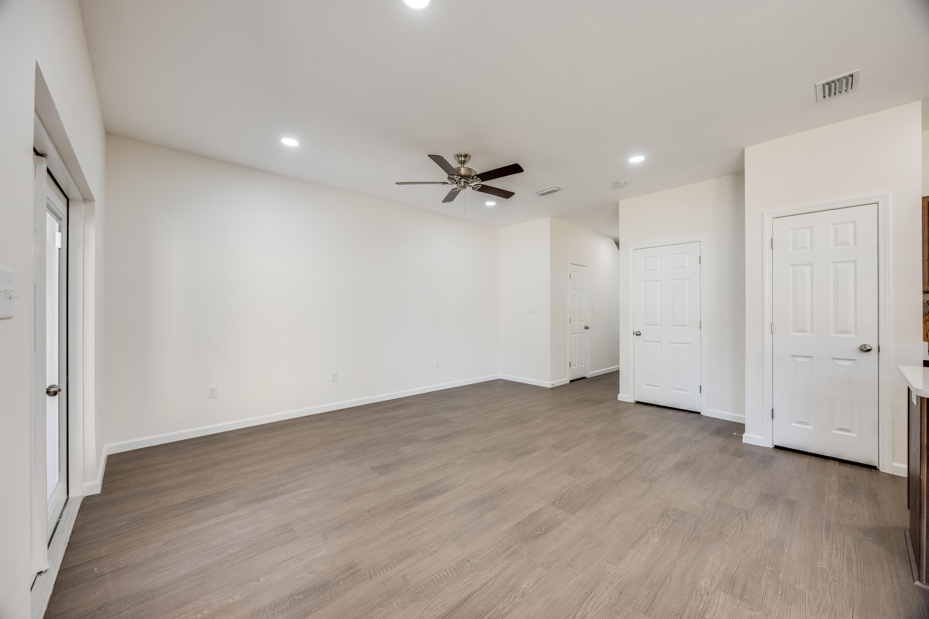 751 Amos Street, Unit A AND B Crestview, FL 32539 - Photo 7 of 47 an empty room with a ceiling fan and a window