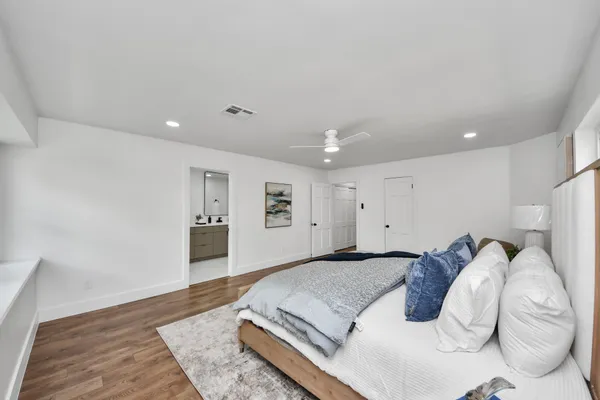 a bed room with a bed and a couch