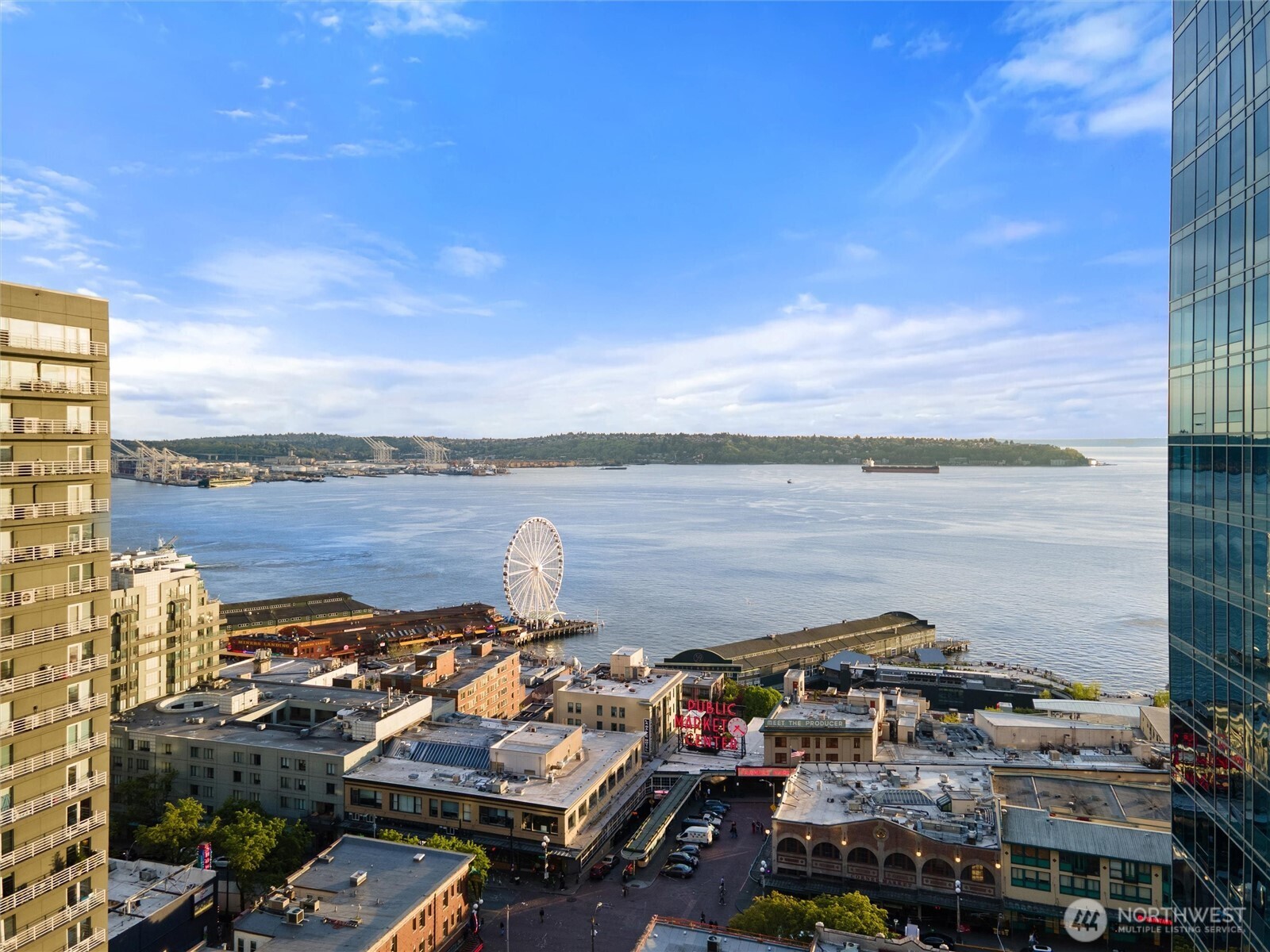 1519 3rd Avenue, Unit 501 Seattle, WA 98101 - Photo 2 of 37 a view of a lake with nearby beach