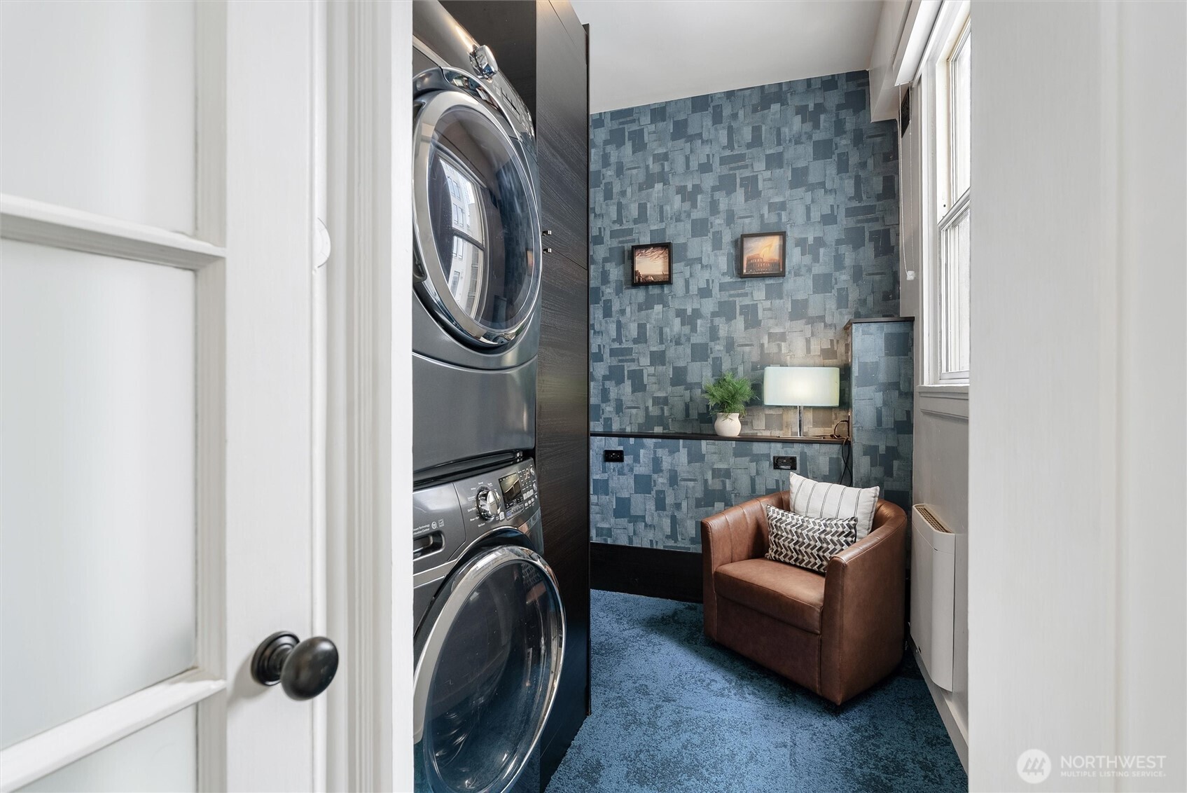 1519 3rd Avenue, Unit 501 Seattle, WA 98101 - Photo 21 of 37 a view of a livingroom with washer and dryer