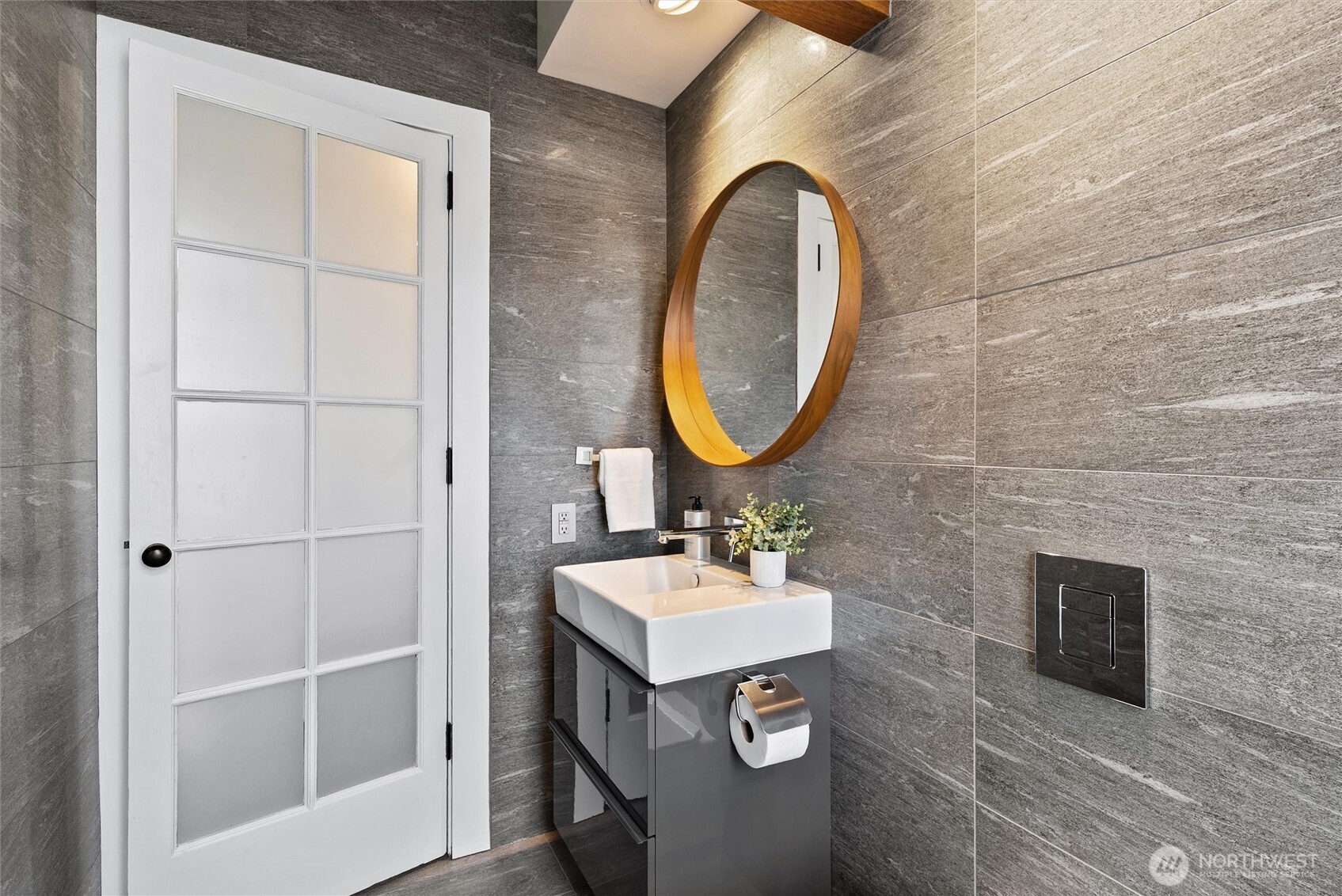1519 3rd Avenue, Unit 501 Seattle, WA 98101 - Photo 30 of 37 a bathroom with a sink and a mirror