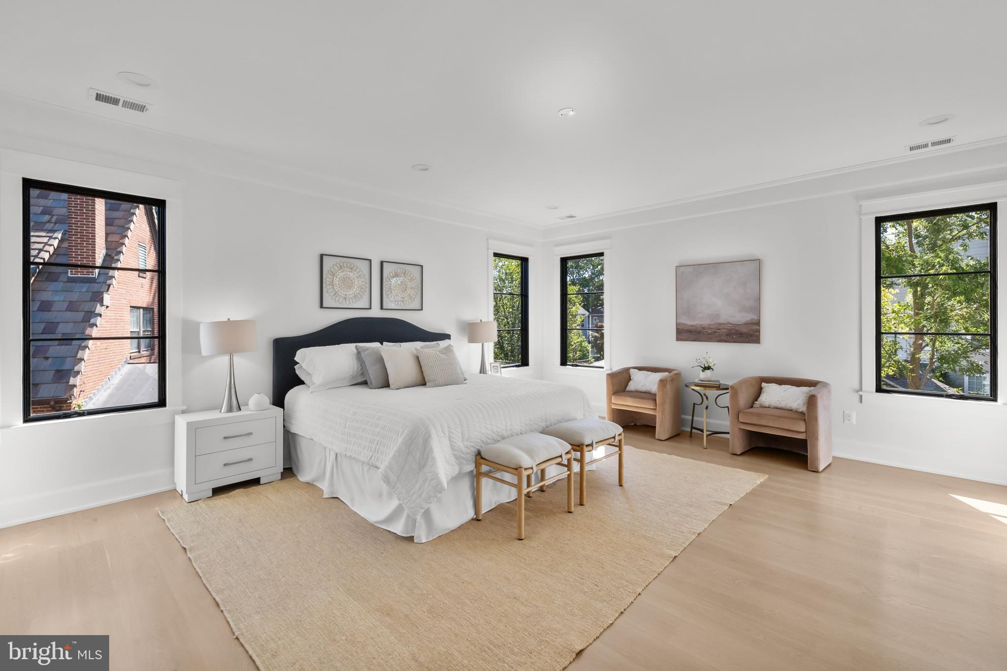 3108 Key Boulevard Arlington, VA 22201 - Photo 21 of 44 a spacious bedroom with a bed and a couch