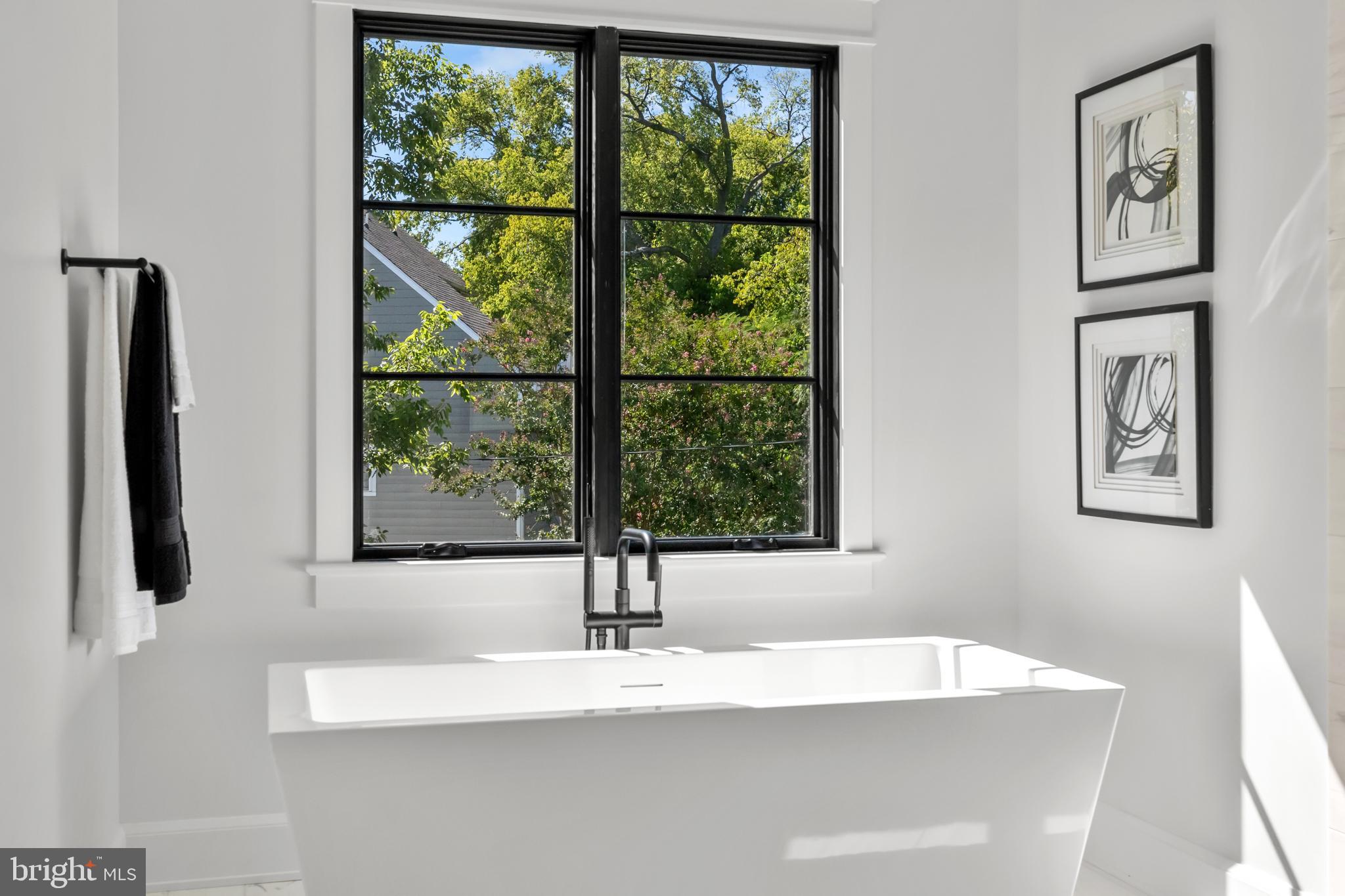 3108 Key Boulevard Arlington, VA 22201 - Photo 25 of 44 a white bath tub sitting next to a window