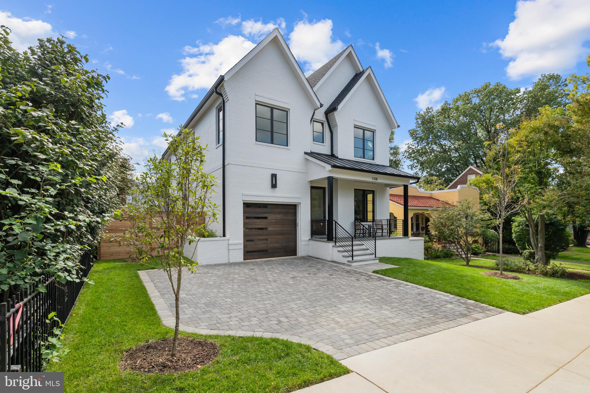 3108 Key Boulevard Arlington, VA 22201 - Photo 3 of 44 a front view of a house with a garden and yard