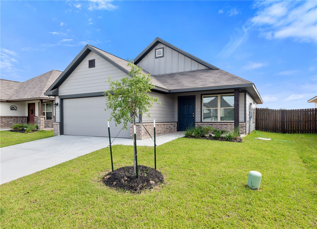 2869 Messenger Way Bryan, TX 77803 - Photo 2 of 23 a front view of a house with a yard