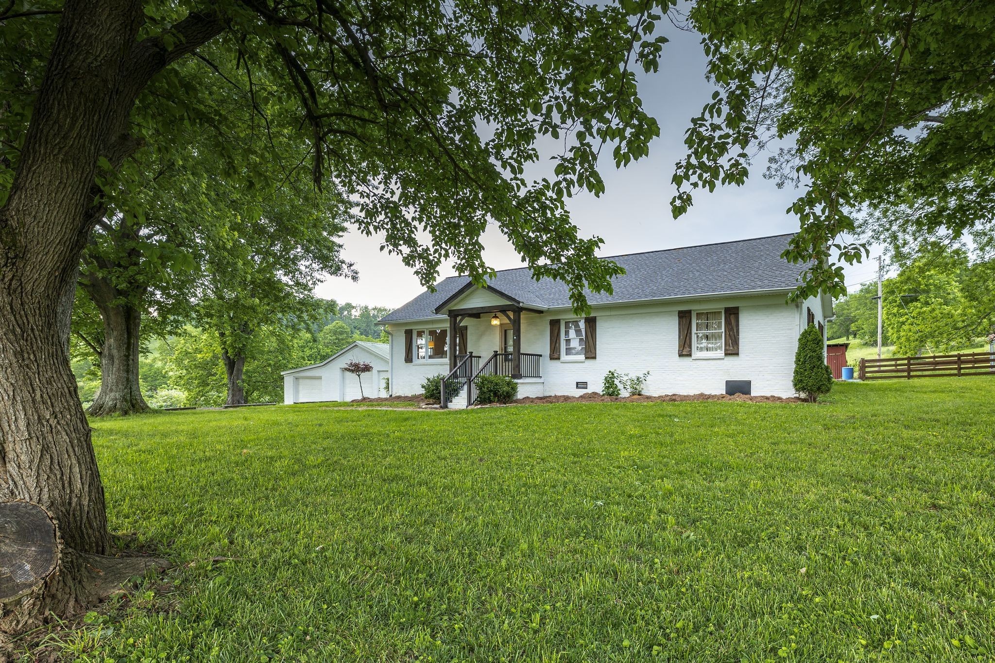 2538 Ragsdale Road Columbia, TN 38401 - Photo 2 of 35 a front view of a house with a garden and trees