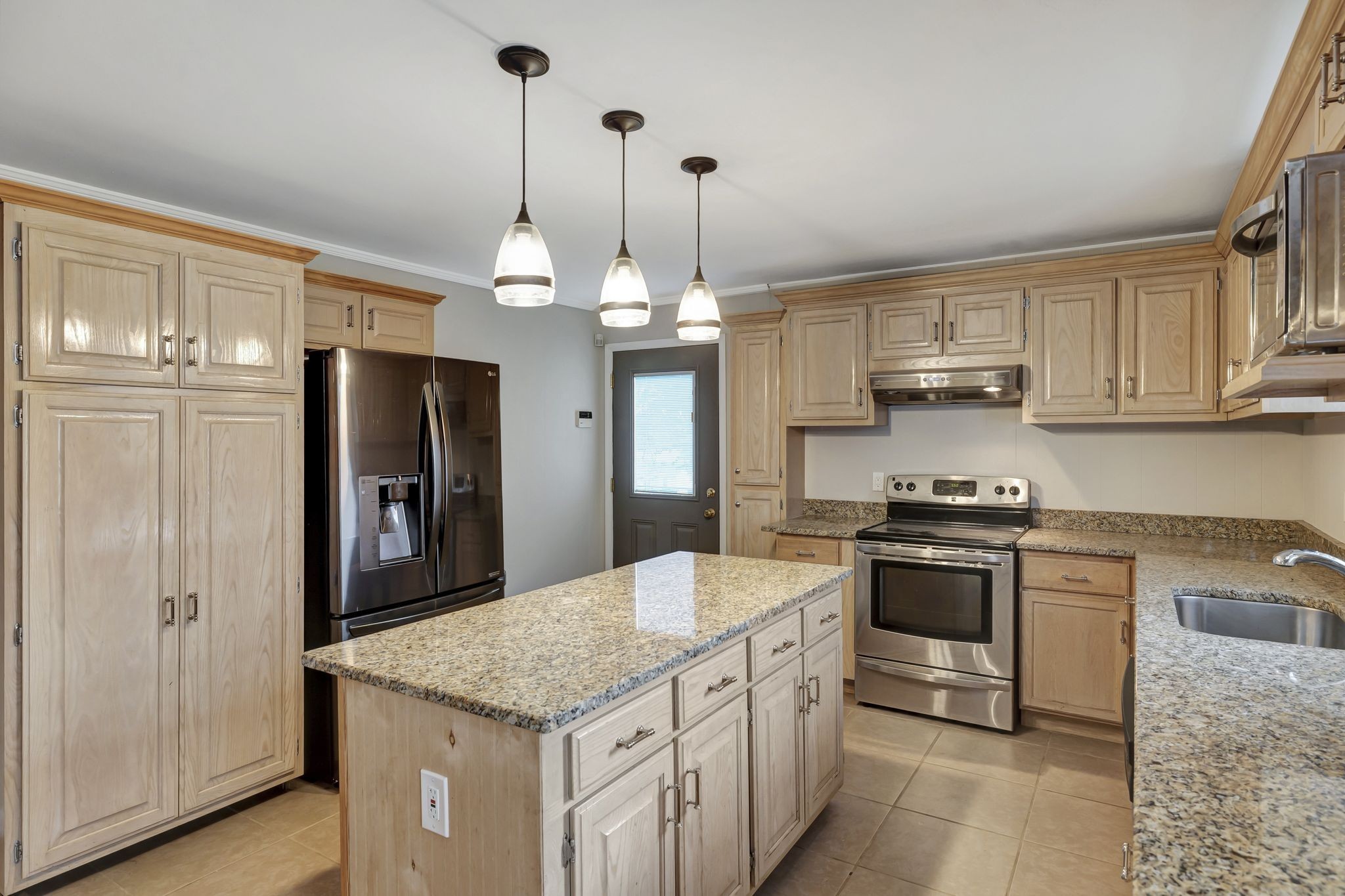 2538 Ragsdale Road Columbia, TN 38401 - Photo 9 of 35 a kitchen with stainless steel appliances granite countertop a sink a stove a refrigerator and cabinets