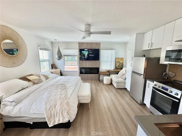 a bedroom with bed and a couch