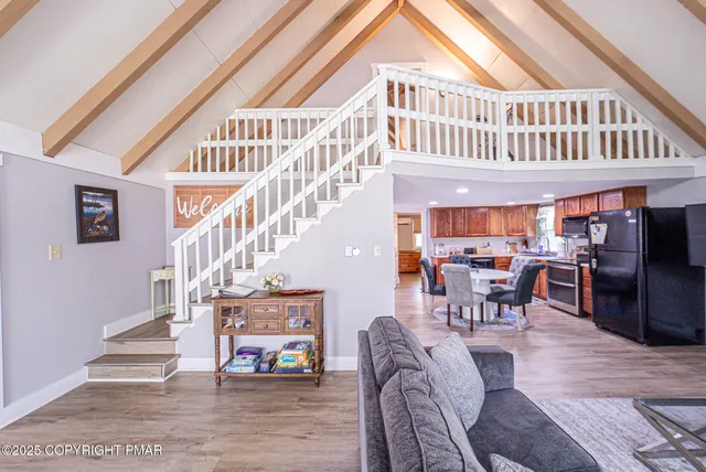 a large kitchen with a table and chairs