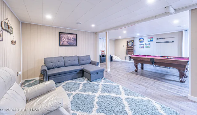 a view of a livingroom with an empty space and a window