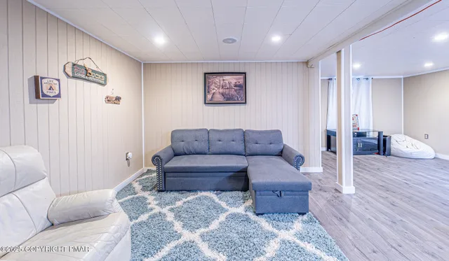 a room with furniture and wooden floor