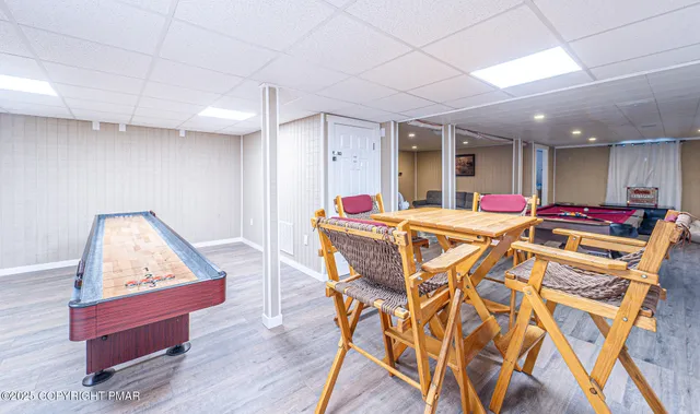 a view of living room with furniture and wooden floor
