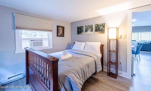 a view of hallway with stairs and wooden floor
